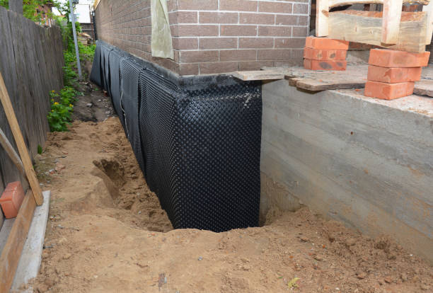 Happy homeowners after waterproofing job in Levittown